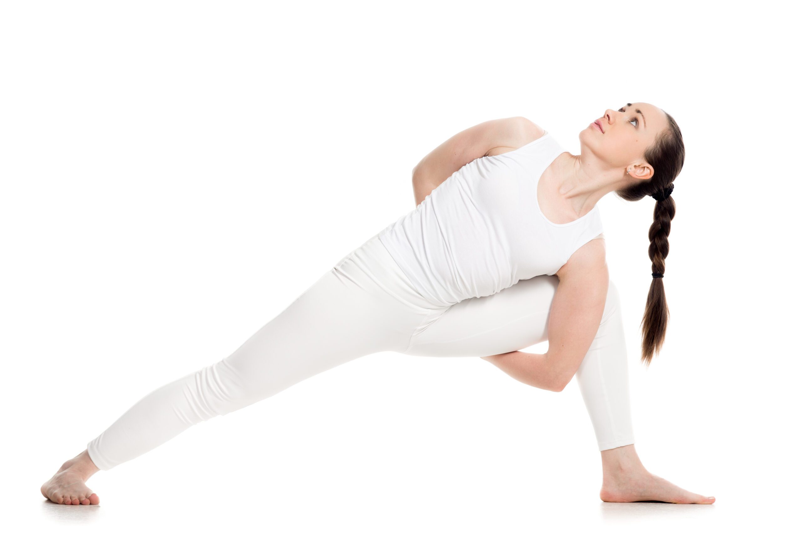 Sporty attractive young woman in white sportswear doing lunge exercise for spine, variation of utthita parshvakonasana with hands behind back, part of large photo series, isolated, full length